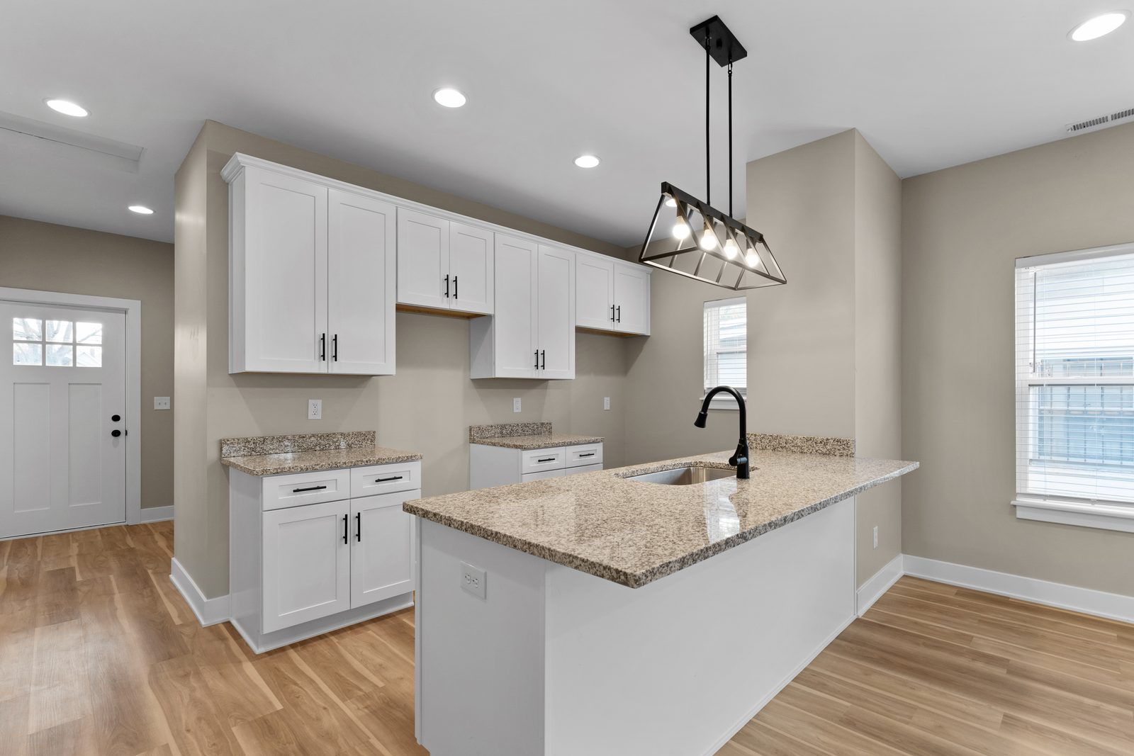 White kitchen with granite island