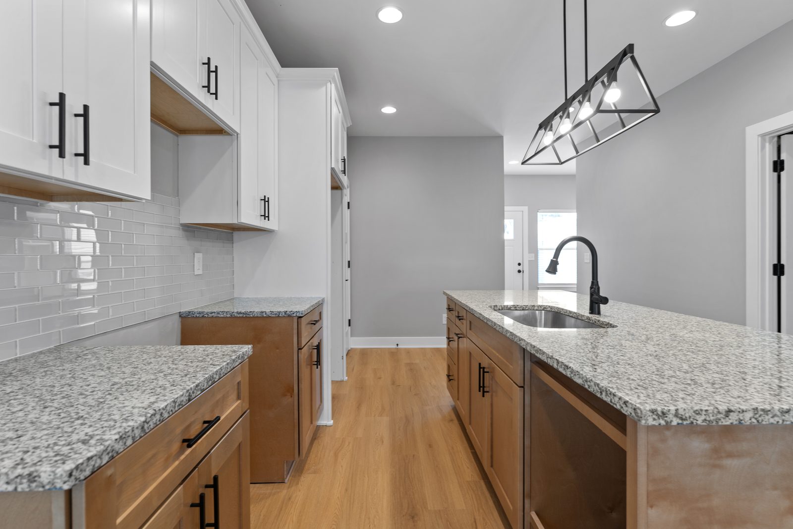 Kitchen with subway tile and wood lowers