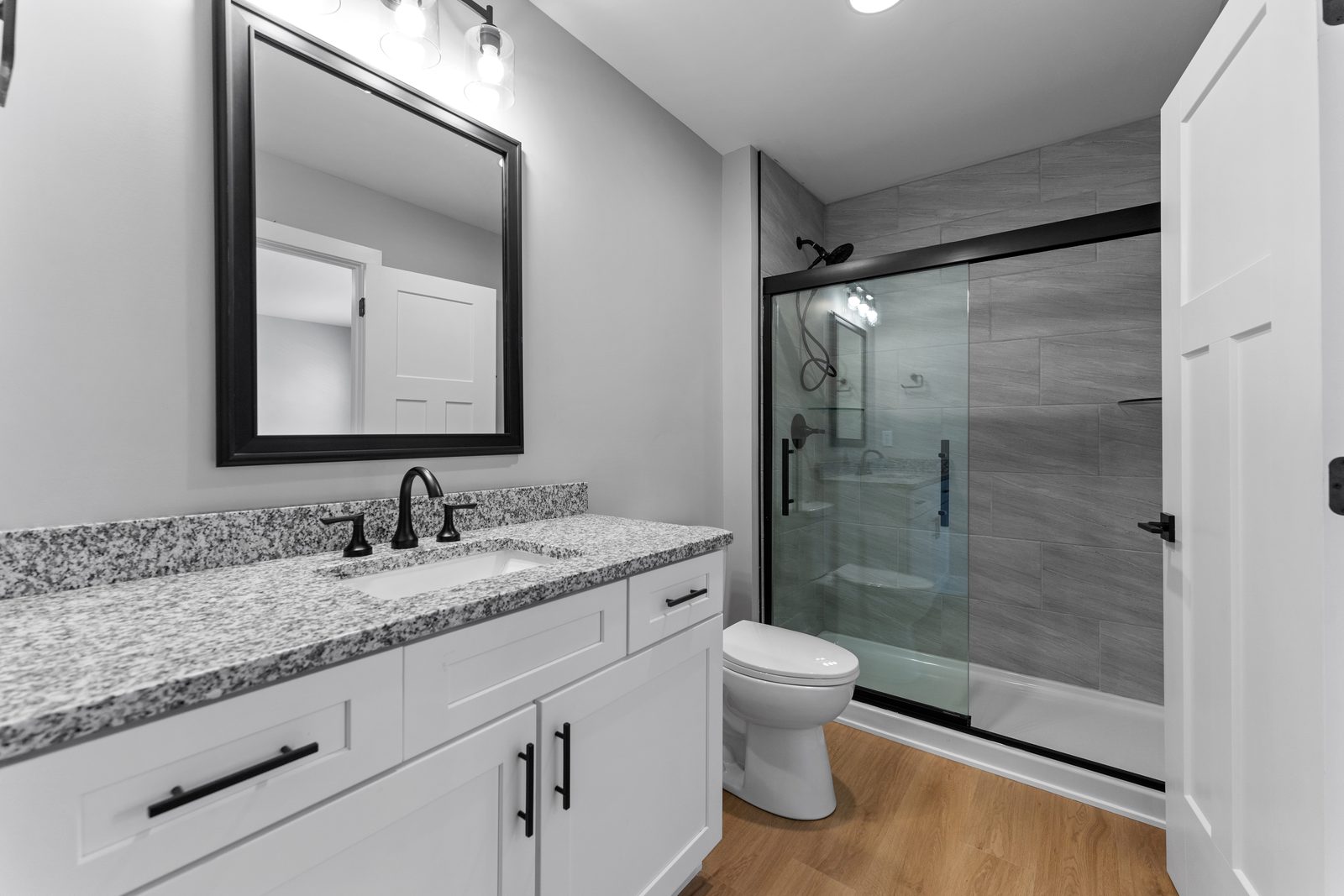 Bath with glass tile shower