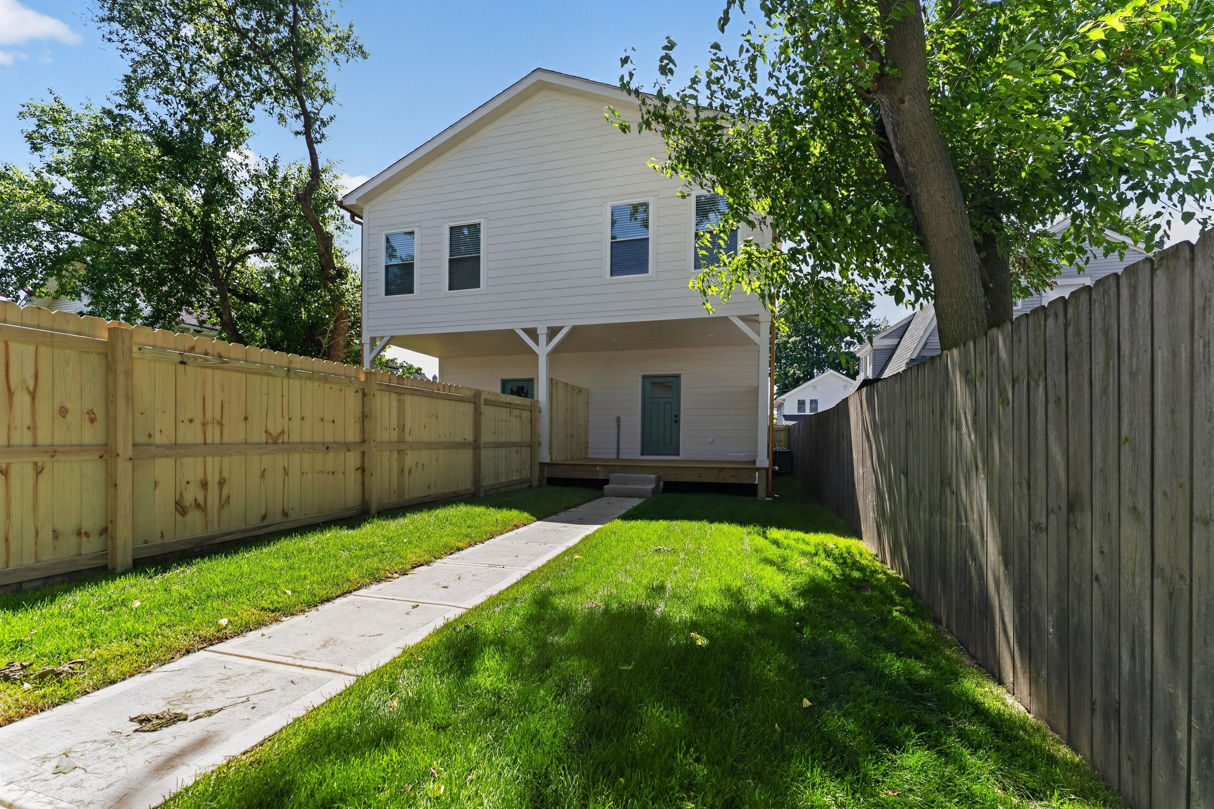 Fenced backyard and rear porch