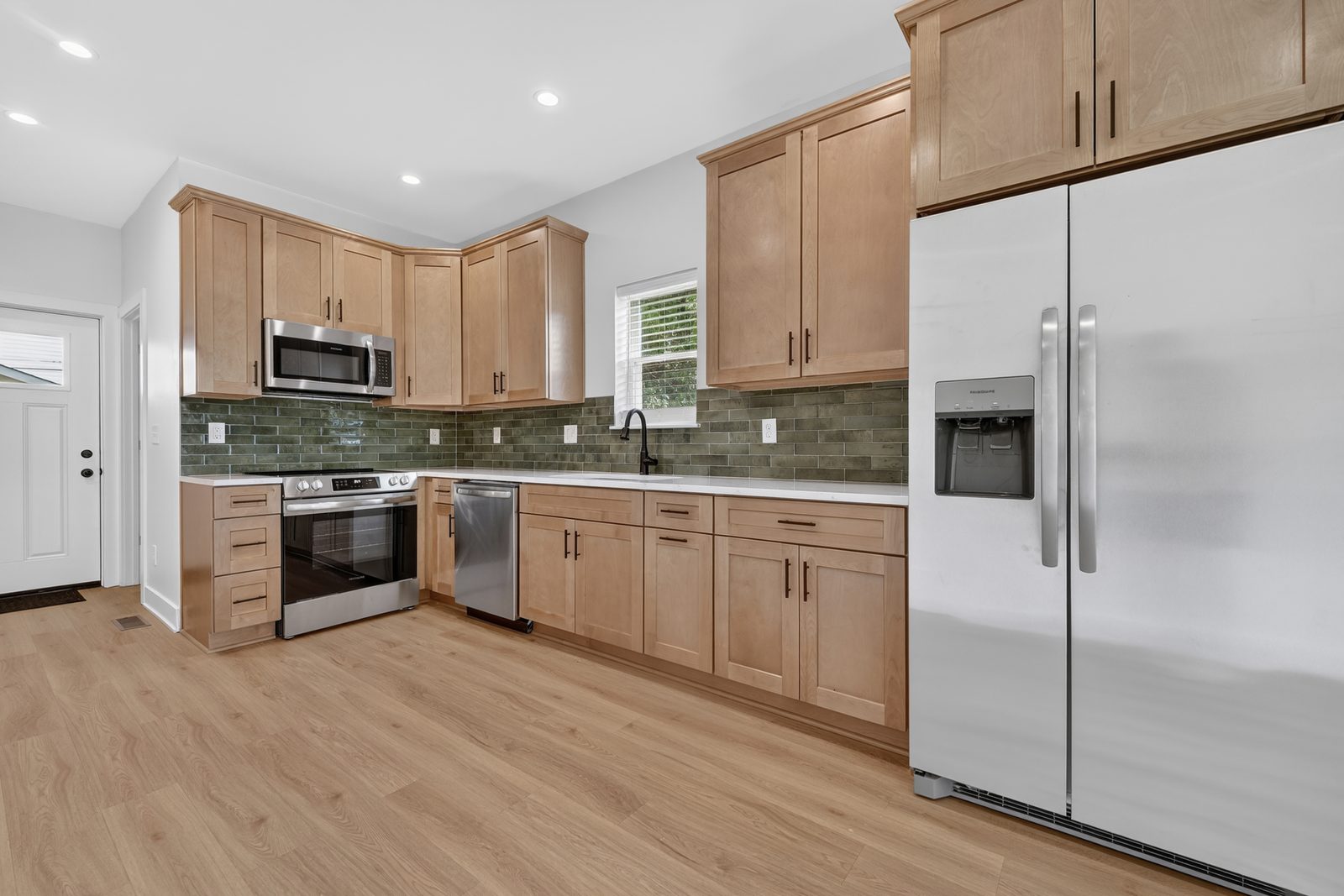 Kitchen with maple cabinets and stainless appliances