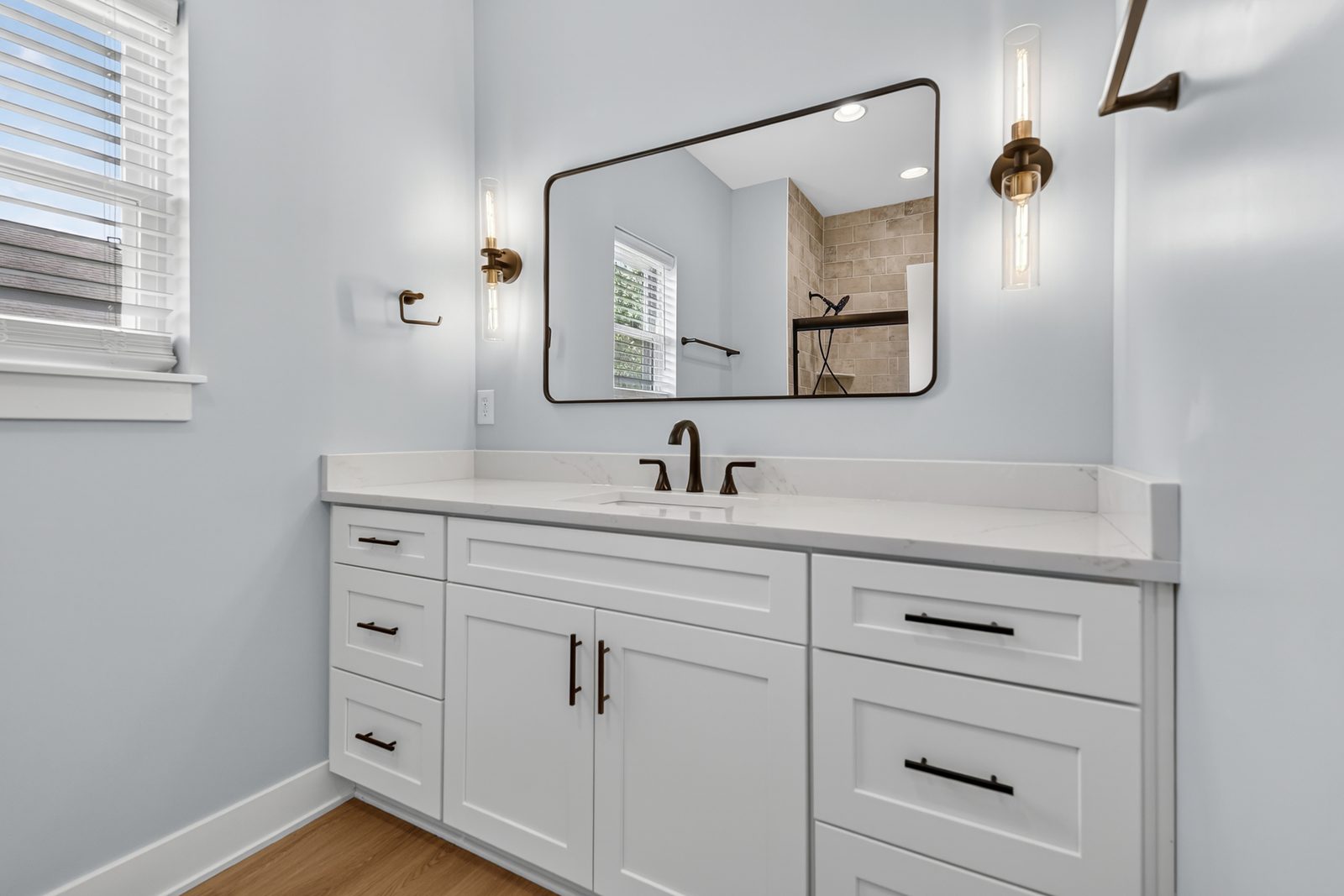 Vanity with brass sconces