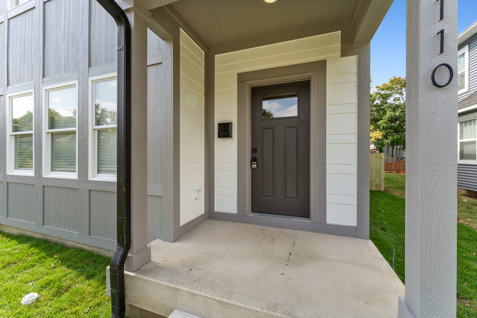 Covered entry with house numbers