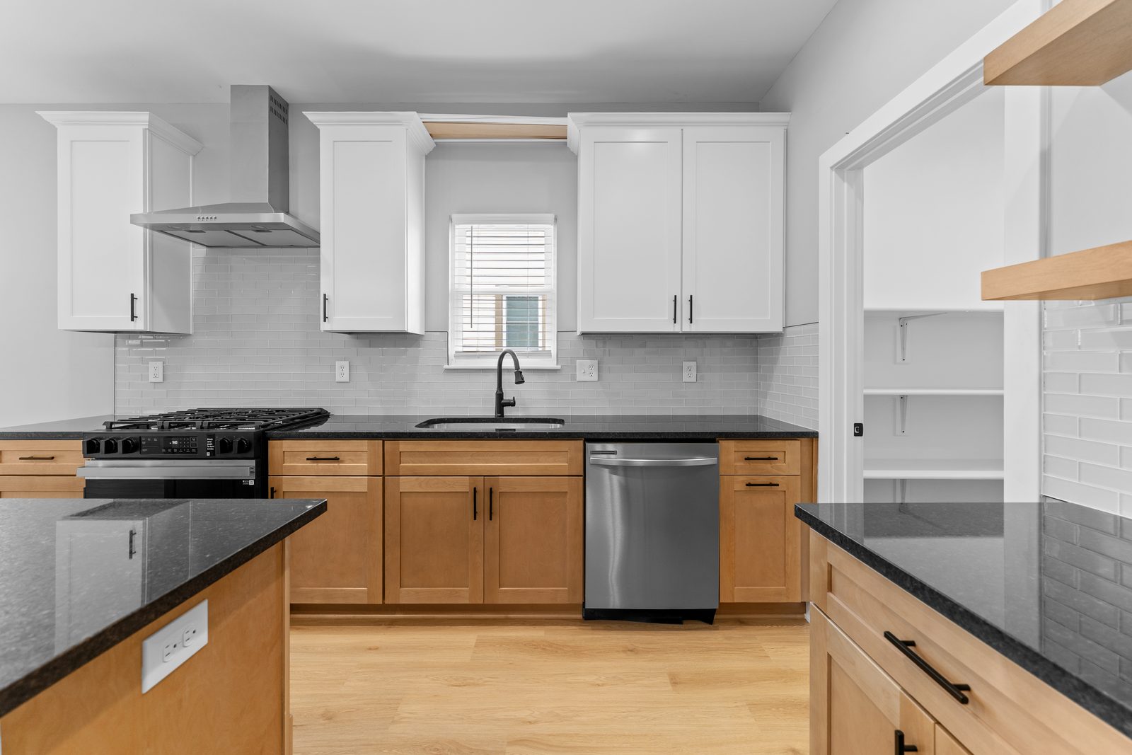 Kitchen range wall with wood lower cabinets