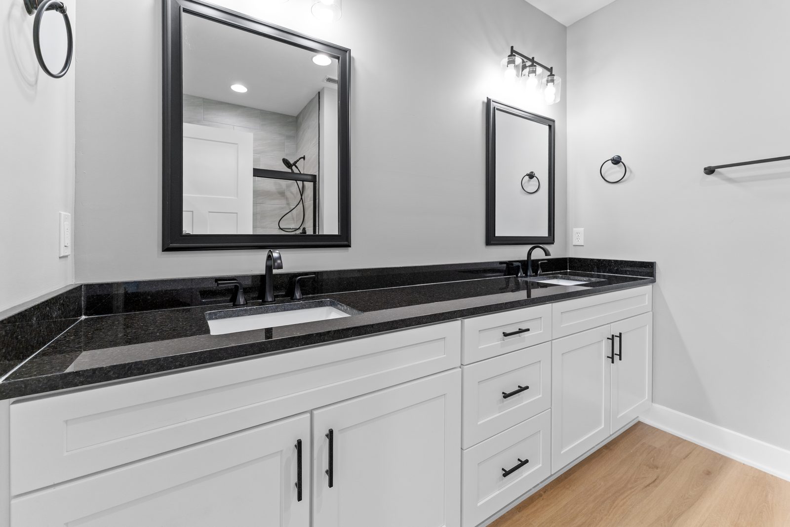 Double vanity with black granite top