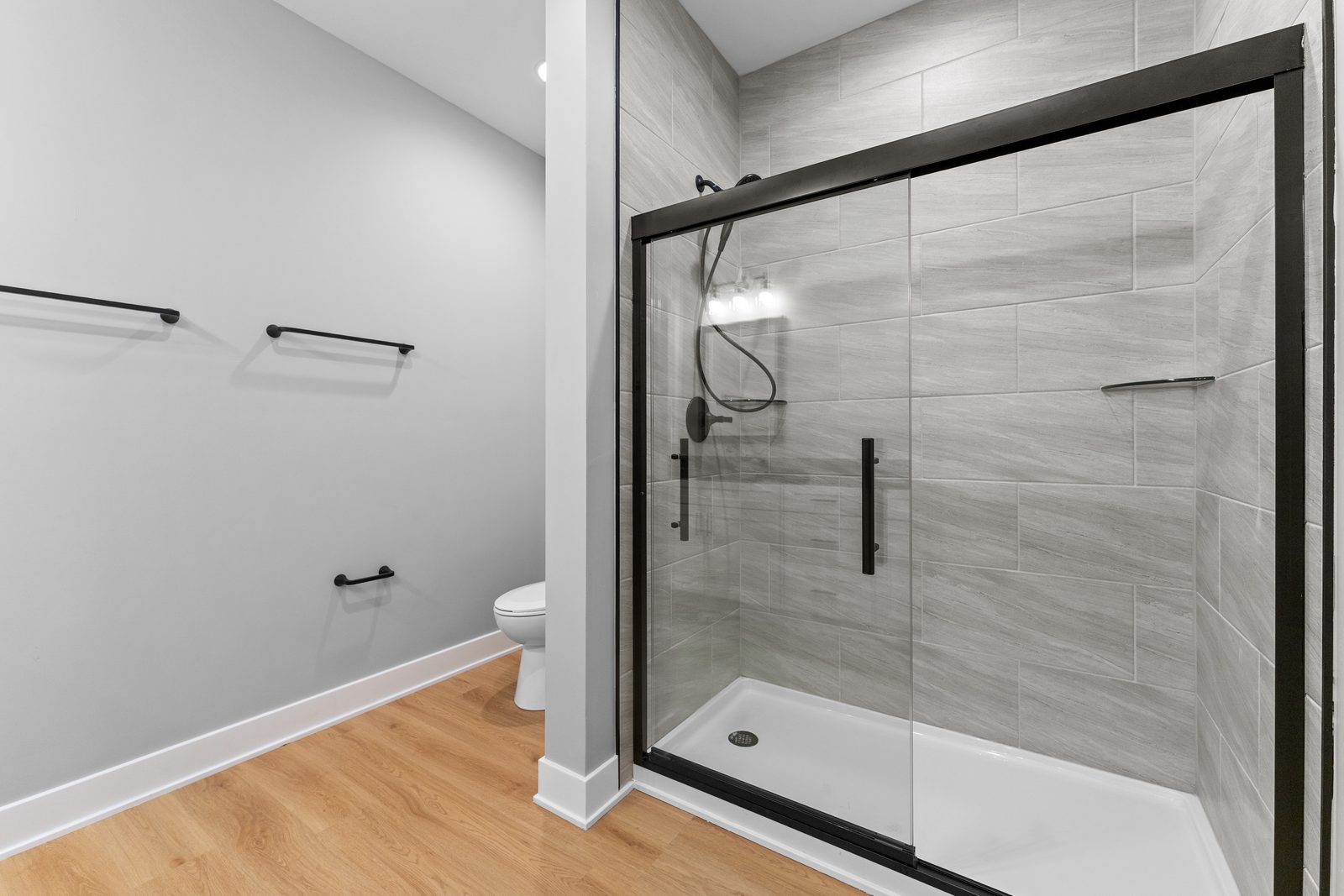 Glass-enclosed tile shower