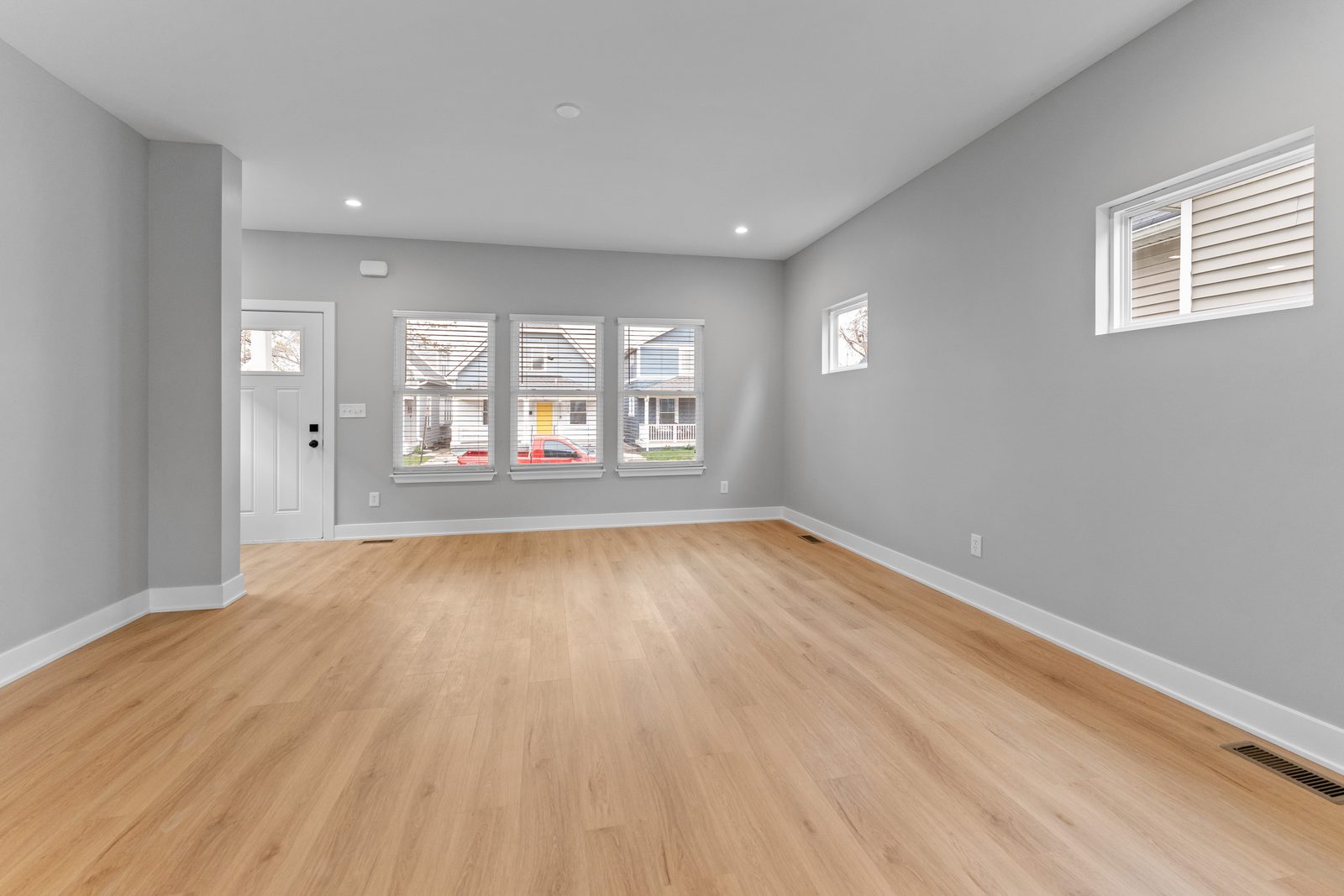 Living room with bright front windows