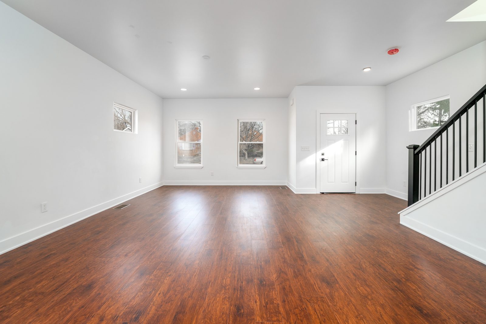 Great room with wood-tone floors