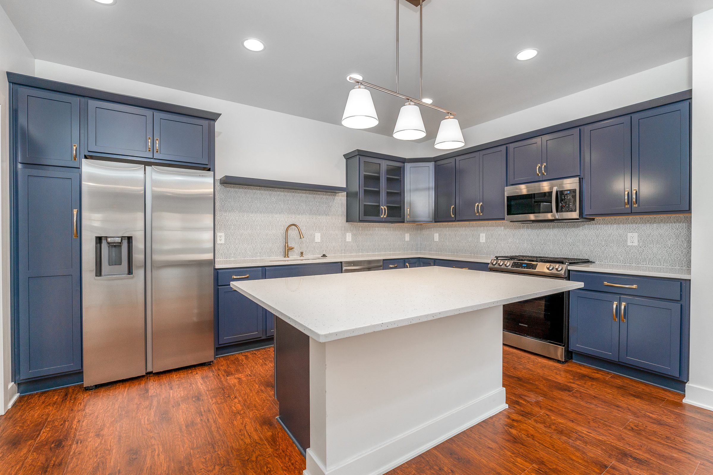 Navy kitchen with a white island