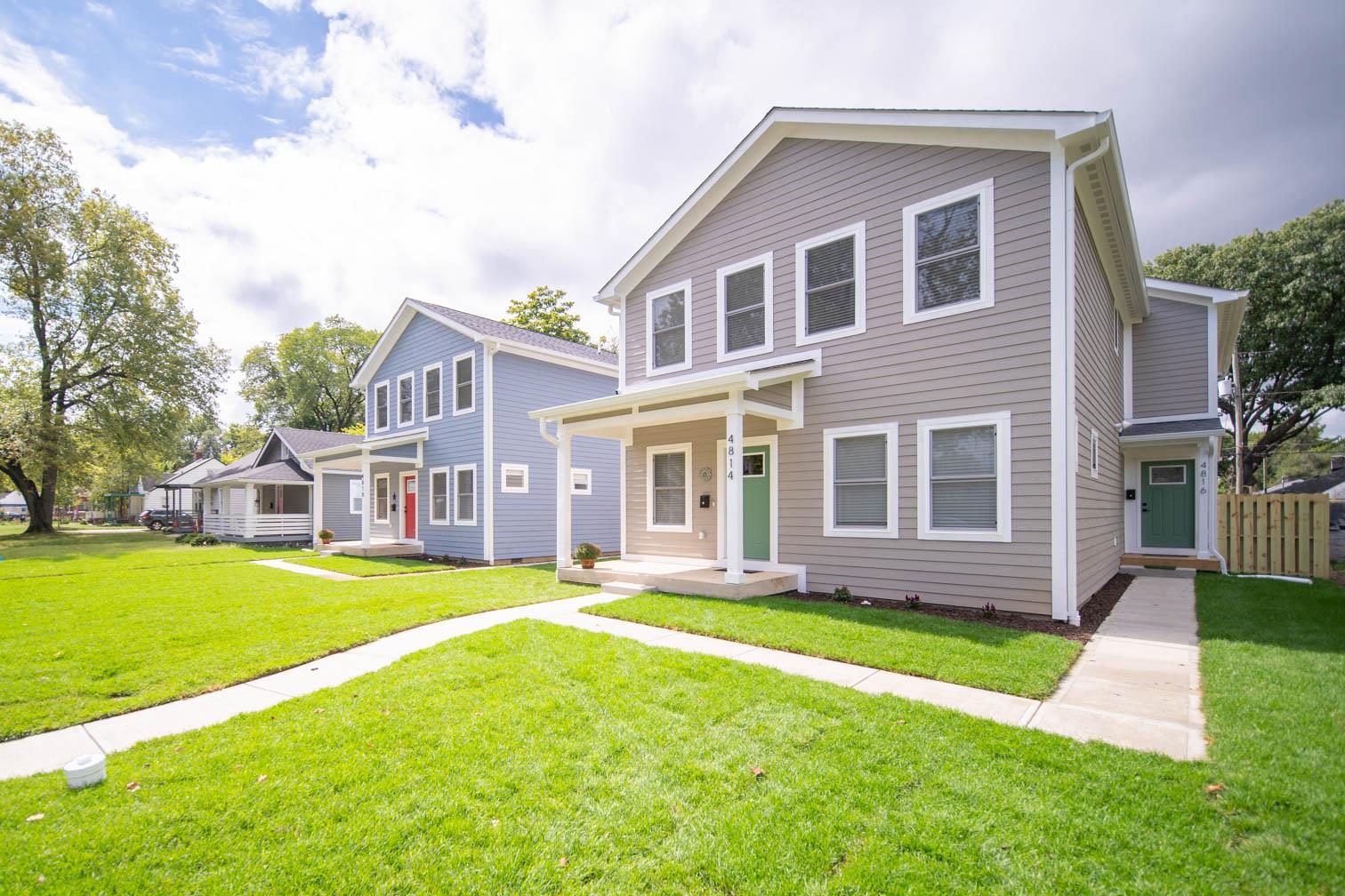 Row of new homes in greige and blue