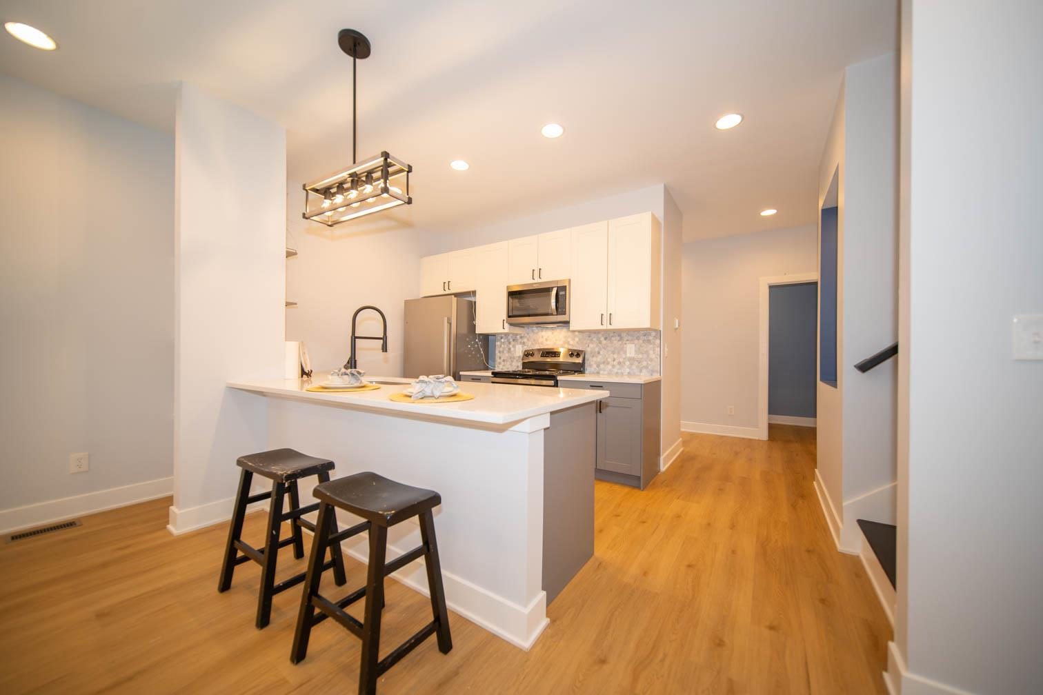 Peninsula kitchen with bar stools